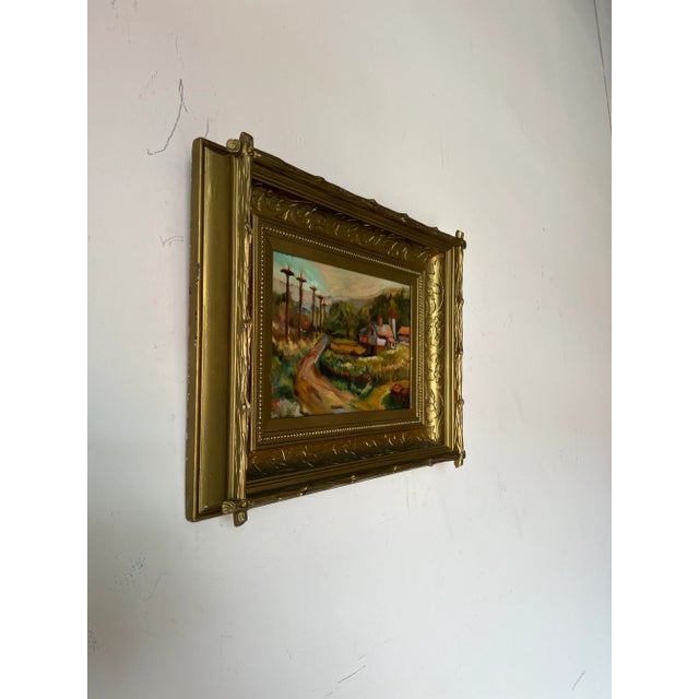 Charming landscape of a countryside house with dirt road surrounded by a beautiful green landscape and mountains by an...