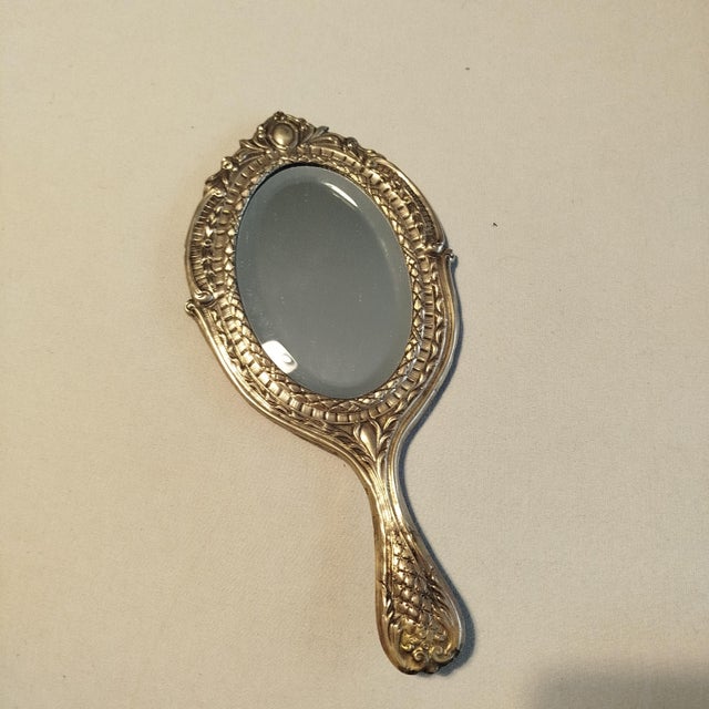 Silver Hand Mirror - 19th Century. 139 grams. Height: 9.85 in (25 cm) Width: 4.73 in (12 cm) Depth: 0.4 in (1 cm). This...