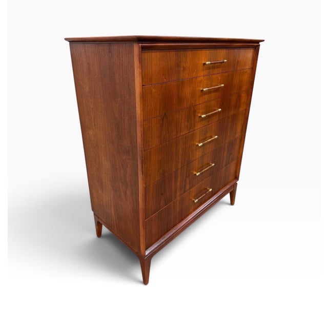 A beautifully restored Mid-Century Modern 5-Drawer Walnut High Chest, dating to the 1960s. This handsome vertical dresser...