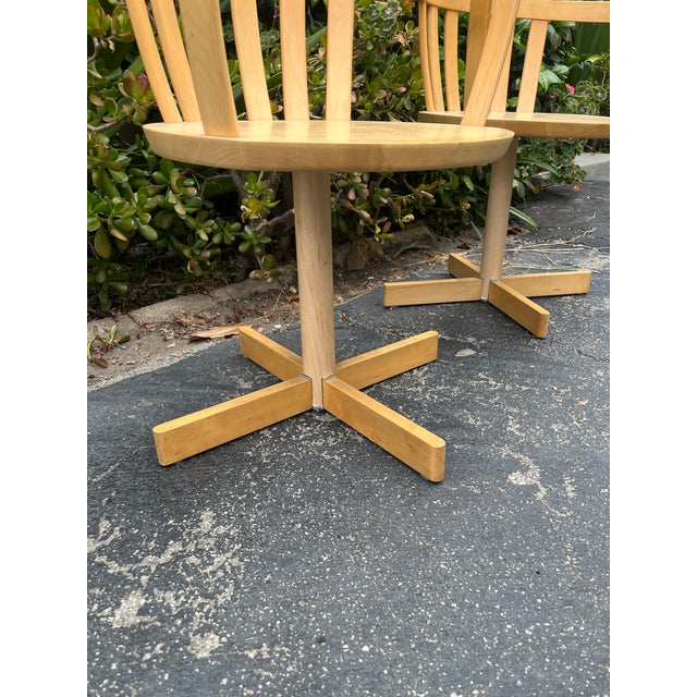 bentwood swivel chairs / captain’s chairs sold as a matching pair. Features curved spindle backs, solid wood construction,...