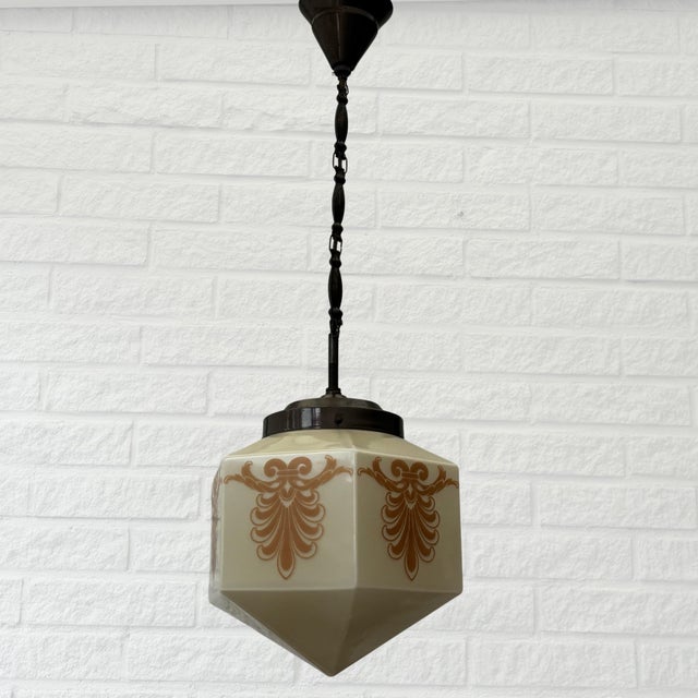 An elegant Swedish pendant lamp from the 1930s, beautifully balancing the geometric restraint of early Modernism with the...
