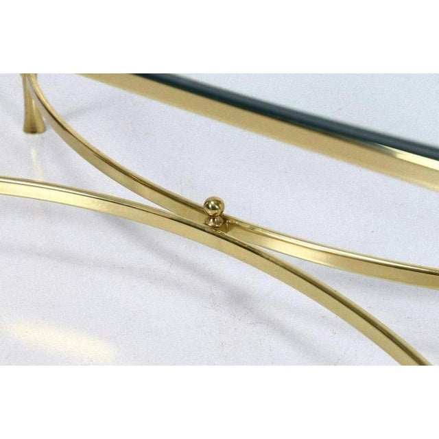 Golden vintage coffee table is a piece of original design furniture realized in the 1950s by Italian manufacture, from...