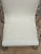 This is an off white leather rocking chair. It has chrome arms. It is sturdy. This would look great in a contemporary...