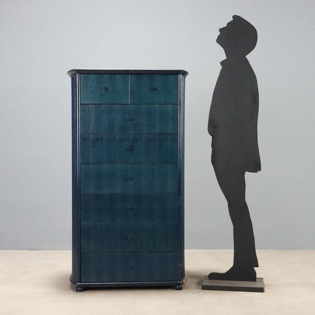 1980s wooden chest of drawers produced by Roberti Rattan, featuring a functional design and a blue teal finish. The...