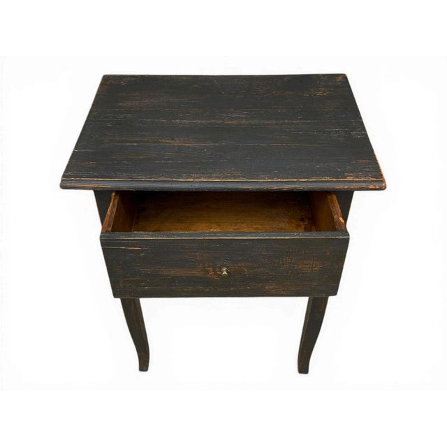 Dark lacquered fir wood side table Alpine fir wood side table dating to around 1850, featuring a front drawer and an...