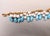 White Vintage Napier Book Piece Goldtone Blue & Turquoise Art Glass Charm Bracelet, 1967 For Sale - Image 8 of 15