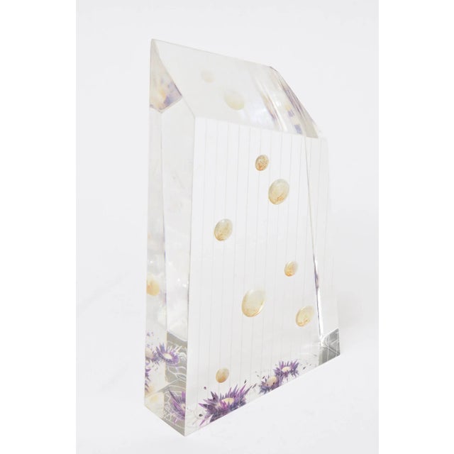 This vintage signed lucite embedded flower sculpture is from the 70's. It is signed on the bottom. The colors are...