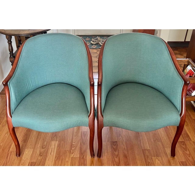 Vintage pair of 1960’s Georgian style Mahogany tub chairs. Elegance comes from the simplicity of the seamless rounded back...