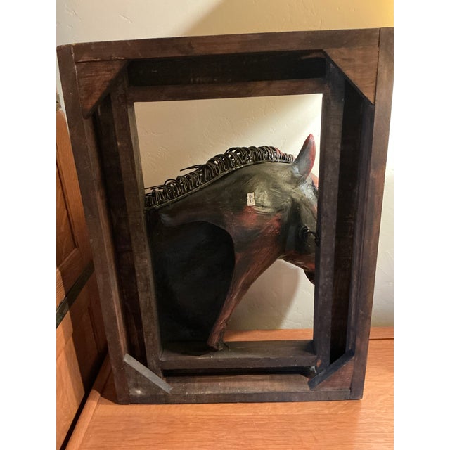 A striking handcrafted three-dimensional horse head sculpture created by an artisan in Mexico. This dramatic mixed-media...
