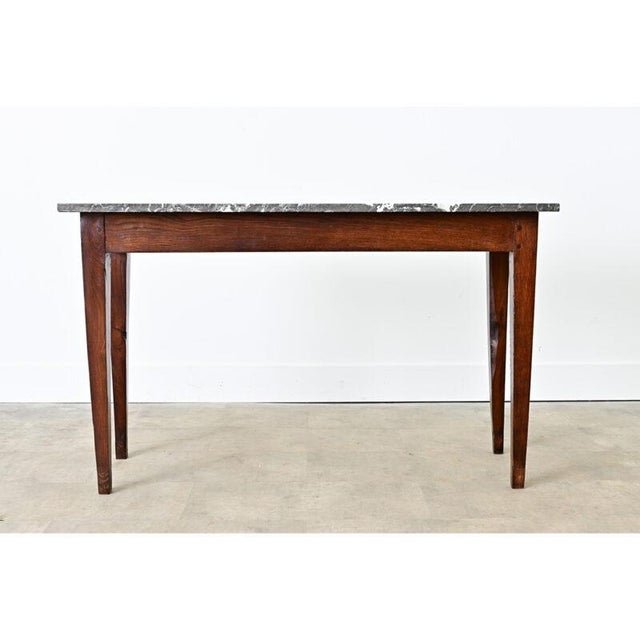 This French 19th century oak console table, formerly a display fixture in a bakery or butcher shop, becomes a versatile...