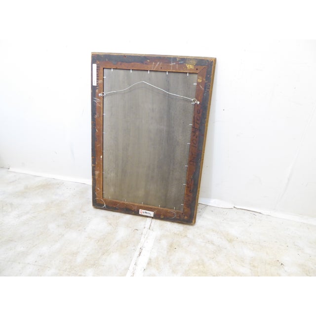 This 19th century silverleaf mirror has an aged patina that gives a tortoise shell like appearance. It measures 29"H x 21"W.