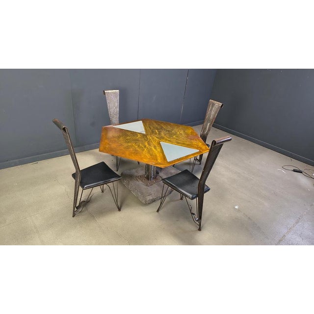 Fully hand crafted dining set with 4 chairs and a hexagonal dining table. The chairs are crafted with a curled steel sheet...