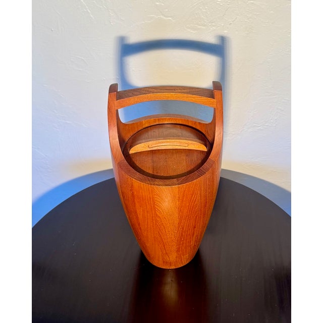 Vintage teak ice bucket attributed to Jens Quistgaard for Dansk. The is the larger, 19-inch high, version with orange...