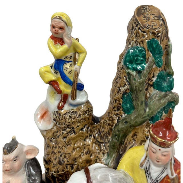 This ceramic figurine group depicts the main characters from the classic Chinese novel Journey to the West. The figures...
