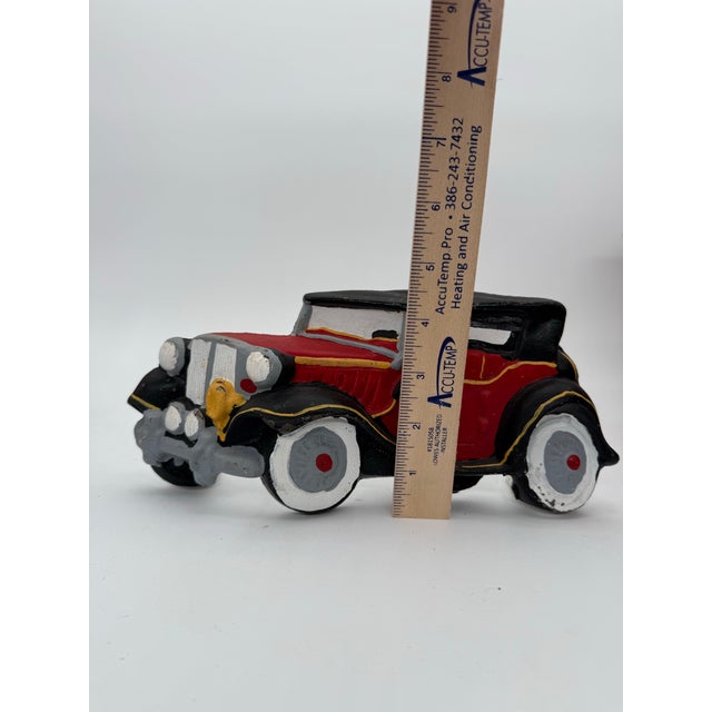 Vintage cast iron doorstop in the shape of an antique car. Made by Big Arrow. It has its original paint but could easily...