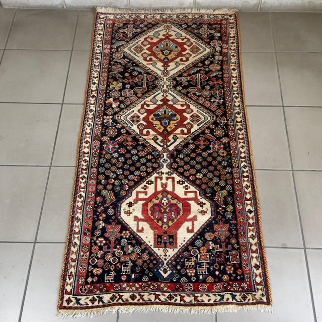 A fine tribal wool runner, attributed to the traditional Kaskay/Afshary nomadic craftsmanship of the 20th century. Subject...