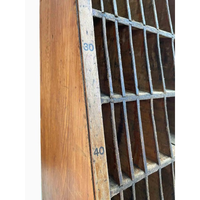 Mid-Century wooden industrial storage or display cubbies. Narrow triangular shape with many slots. An American industry...