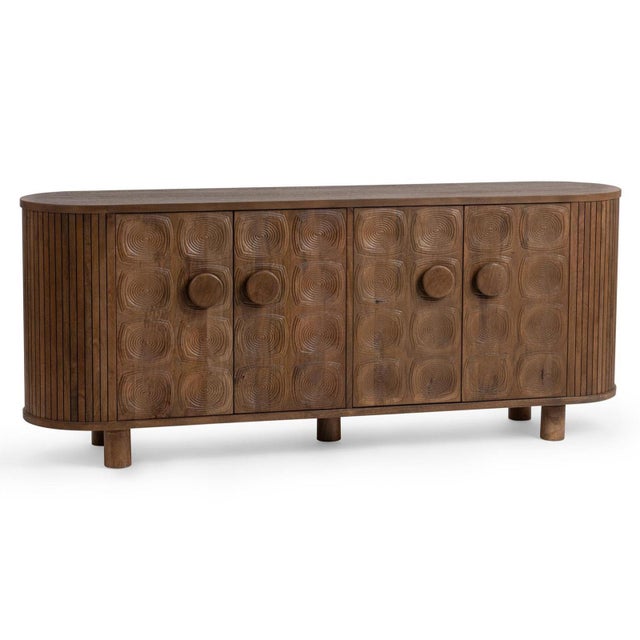 Expertly crafted from solid mango wood, this sideboard has a gently rounded silhouette softened by fluted waterfall ends....