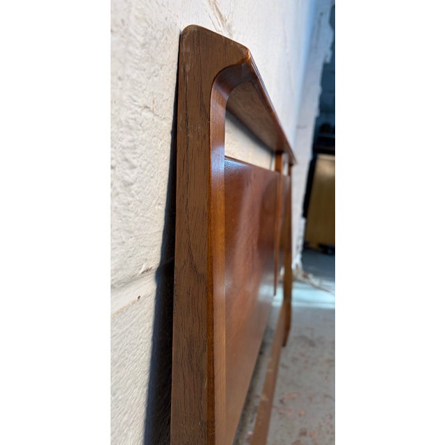 Crafted in the mid-1950s as part of the celebrated Profile collection designed by John Van Koert for Drexel, this walnut...