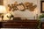 Striking vintage musical wall plaque featuring a dimensional arrangement of classical instruments surrounded by ornate...