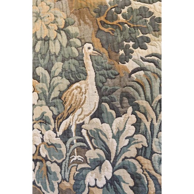 A decorative tapestry from the mid-20th century made using the jacquard technique, depicting a romantic landscape with a...