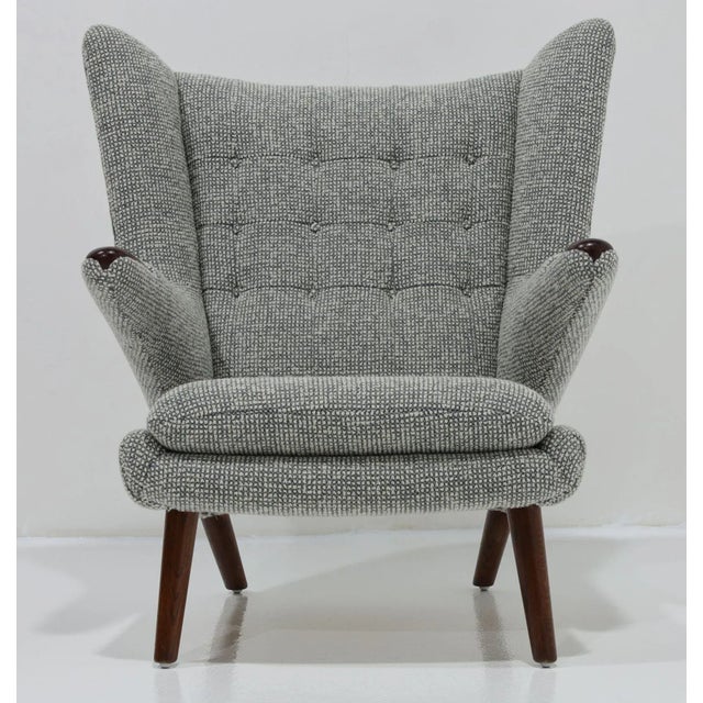 The Hans J. Wegner 1914-2007 "Papa Bear" Chair, model AP19, produced for A.P Mobler and designed in 1951, epitomizes...