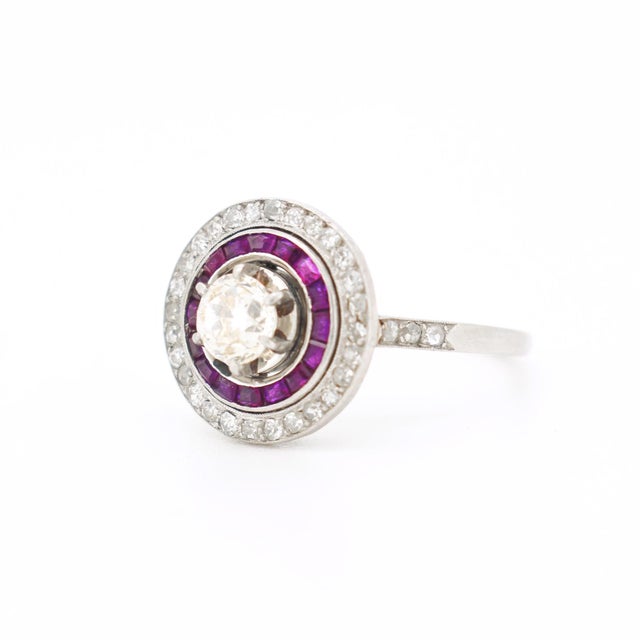 Art Deco engagement ring, crafted around 1930, is a perfect example of the geometric elegance and attention to detail of...