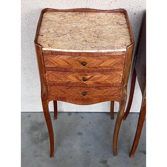 Antique French Louis XVI style pair of nightstands topped with a white marble, cabriole legs. Three dovetailed small...