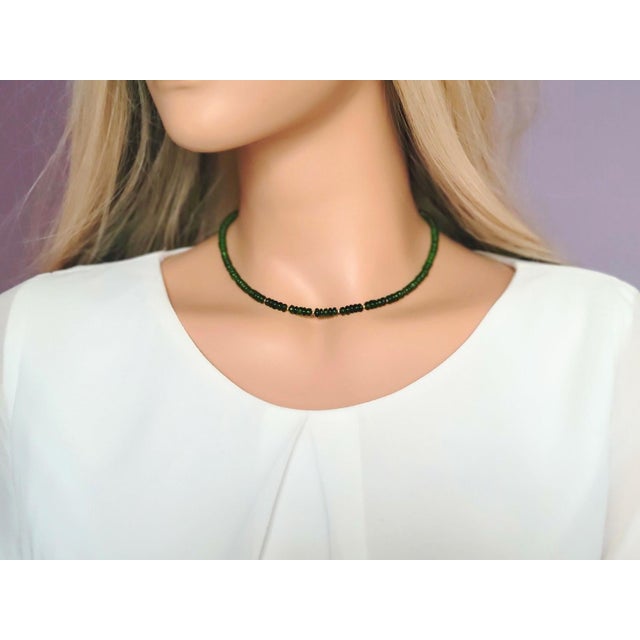 The length of the necklace is 16.5 inches (42 cm). The size of the smooth rondelle beads is 4 mm. The tsavorite beads are...