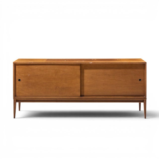 Paul McCobb for Planner Group Mid Century Maple Sliding Door Credenza This credenza measures: 60 wide x 18.25 deep x 25.5...