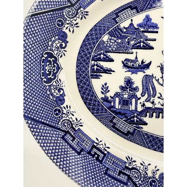 Bring classic English tableware charm to your home with this **Vintage MCM Churchill of England Blue Willow Oval Serving...