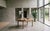 A sculptural Danish mid-century dining table designed by Henning Kjærnulf, crafted from solid oak with a beautifully warm...