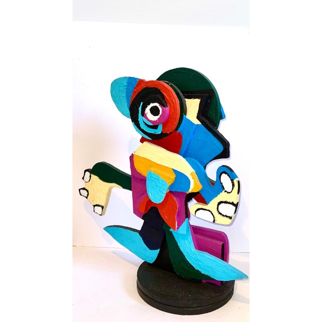 This is an original wooden sculpture with hand painting on both sides. it does not appear to be signed or numbered and...