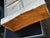 Small antique wooden storage unit, composed of eight drawers arranged in two columns, with molded fronts and wooden knobs....
