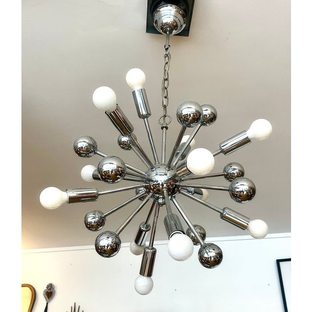 Spectacular large Italian Space Age chandelier, attributed to Goffredo Reggiani, crafted from chromed metal and composed...