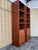 A pair of Vintage Single-Column Danish Teak Bookcases with Cabinet Storage. Circa 1970s Features a mid-century modern...