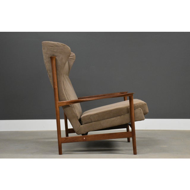 A beautiful mid century modern walnut frame lounge chair designed by Ib Kofod Larsen for Selig. Newly reupholstered in...