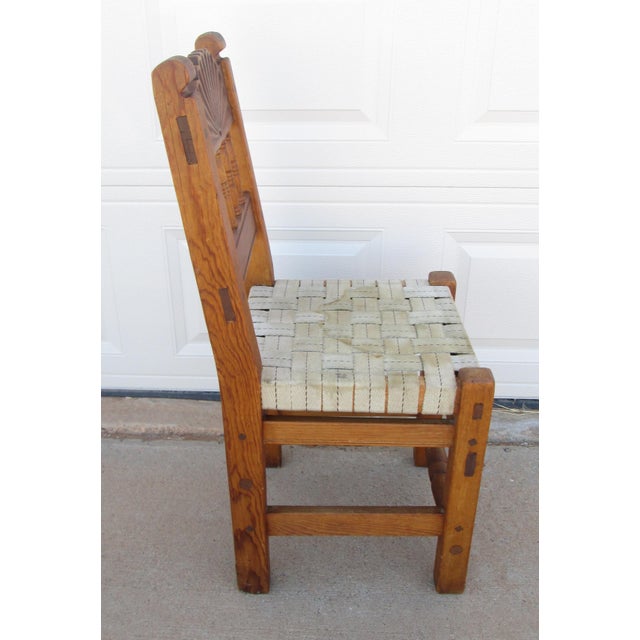New Mexico Spanish Colonial Revival handmade pine chair. The rustic chair is likely made during the WPA era. The chair is...