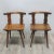 These two chairs were produced around 1900 and have a curved back rest.