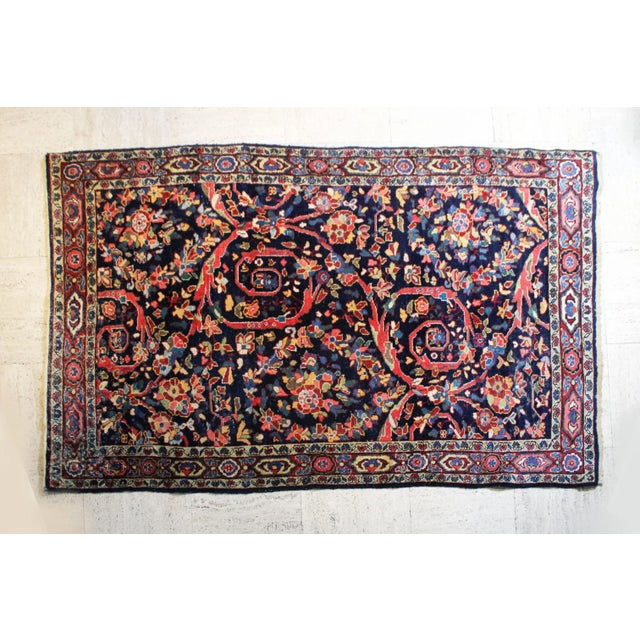 Middle Eastern rug in pure virgin wool, finely hand-woven and natural dyes. Decorated with floral patterns and scrollwork,...