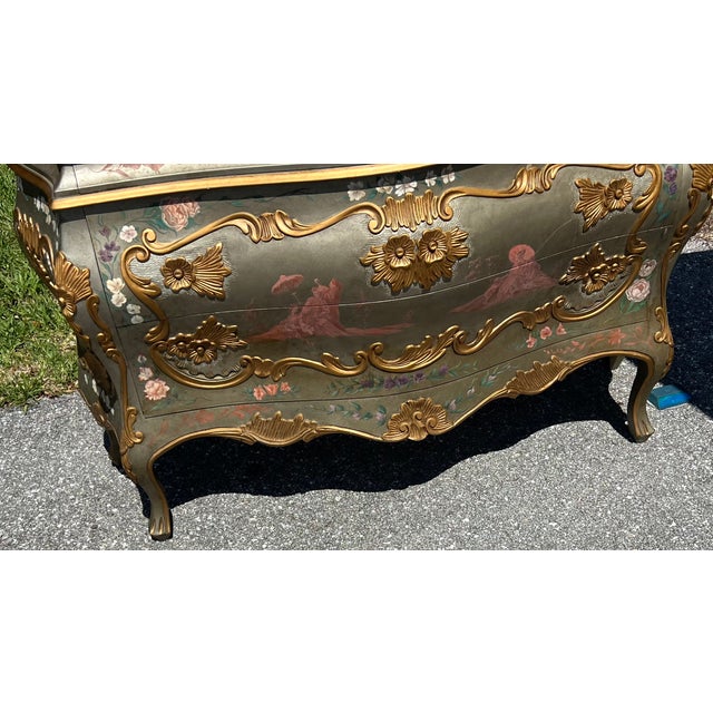 This is one of the most beautiful multi-colored paint decorated bombe commode. The six handles shown have never been attached