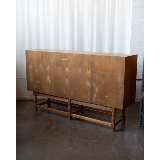 A large and well-proportioned Danish oak sideboard produced in the 1970s in the manner of Henning Kjærnulf — sharing the...