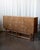A large and well-proportioned Danish oak sideboard produced in the 1970s in the manner of Henning Kjærnulf — sharing the...
