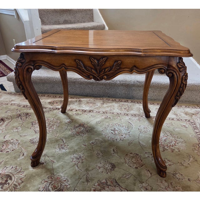 French Accent Table with beautiful warm finish and highly detailed carvings. Slender cabriole legs and sculped edge. ....
