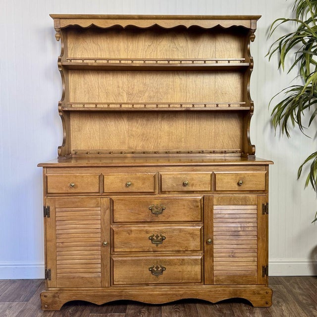 Lovely vintage two-piece maple cabinet / hutch with real cottagecore vibes. This piece features a warm wood tone,...