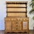 Lovely vintage two-piece maple cabinet / hutch with real cottagecore vibes. This piece features a warm wood tone,...
