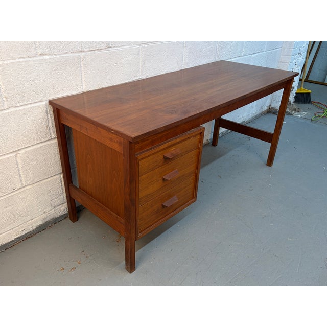 Add timeless Scandinavian style to your workspace with this Mid-Century Modern Danish teak writing desk. Beautifully...