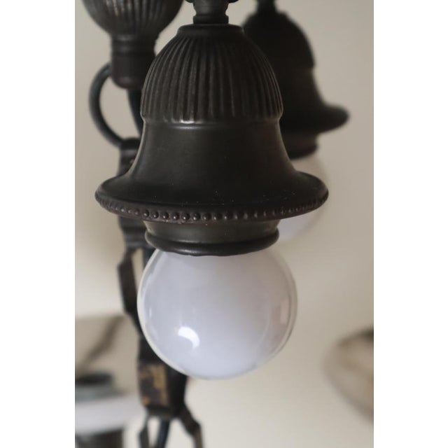 This beautiful chandelier was made in 1930s Germany. It's made of metal and beautiful, hand-crafted alabaster bowls. I'm...