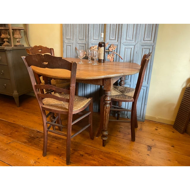A beautiful, quite large drop-leaf table from France, period 1890-1900. The table can be used in various positions: as a...