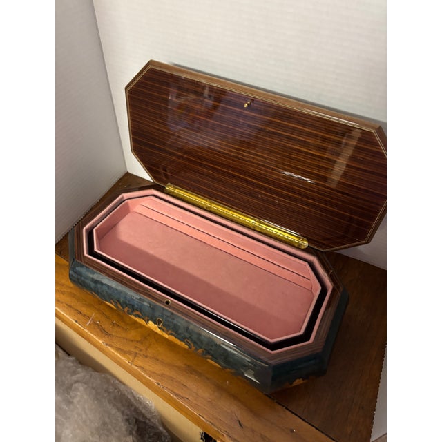 Vintage Reuge Musical Jewelry Box made in Italy with Swiss movement. Blue green lacquer base with vase of gold and brown...